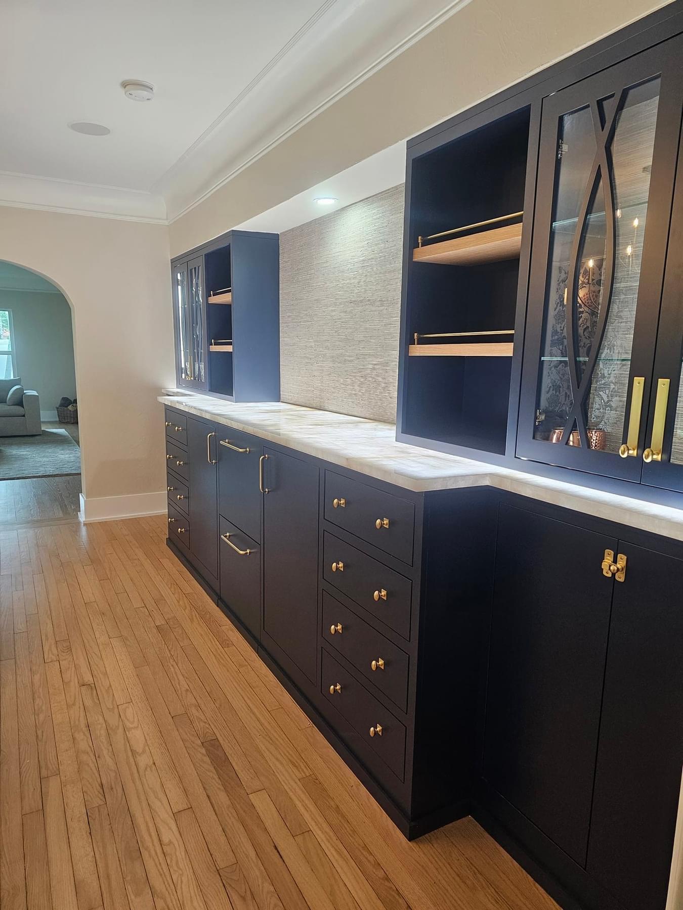 Navy custom cabinetry with gold hardware